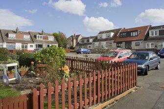 View of terraced housing arranged around a communal parking square, off the main thoroughfare of Castlehill, Bo'ness. The image shows 12-22 Castlehill, taken from the North-West (through the garden of No 2). This photograph was taken as part of the Bo'ness Urban Survey to illustrate the character of Deanfield Area of Townscape Character.