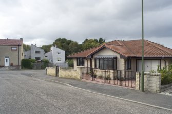 View of detached villa at 96 Deanfield Road, Bo'ness, taken from the South-East, with terraced housing on Kilsland Terrace in the background. This photograph was taken as part of the Bo'ness Urban Survey to illustrate the character of Deanfield Area of Townscape Character.