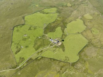 Oblique aerial view of Craigbirnoch farmstead and field system, taken from the NNE.