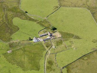 Oblique aerial view of Craigbirnoch farmstead and field system, taken from the ENE.