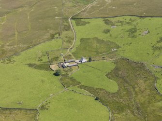 Oblique aerial view of Craigbirnoch farmstead and field system, taken from the W.