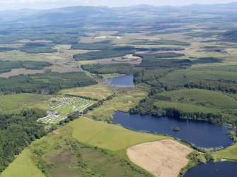 General oblique aerial view of the crannog in Loch Heron, taken from the SW.