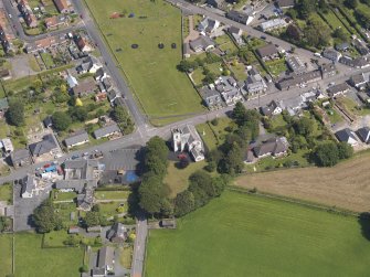 Oblique aerial view of Kirkcowan Parish Church, taken from the WSW.