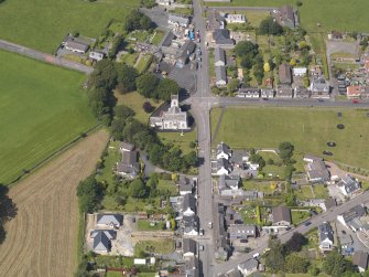 Oblique aerial view of Kirkcowan Parish Church, taken from the SSE.