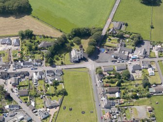 Oblique aerial view of Kirkcowan Parish Church, taken from the ENE.