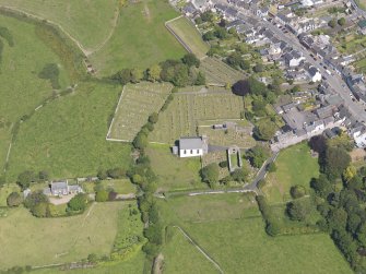 Oblique aerial view of Whithorn Parish Church, taken from the SW.