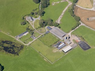 Oblique aerial view of Baldoon Mains, taken from the SSW.