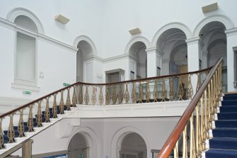 Interior. 1st floor, main staircase hall, view from half landing to E