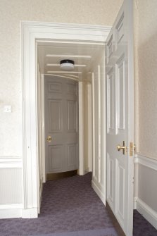 Interior. 1st floor, room to N of main hall, view through doorway showing curved door to ante room beyond