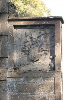 Detail of carved panel with coat of arms on south gate pillar.