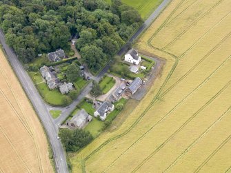 Oblique aerial view of Kingscavil Cottages, taken from the NW.