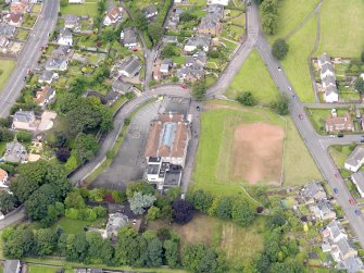 Oblique aerial view of Bo'Ness, centred on Grange School, taken from the ESE.