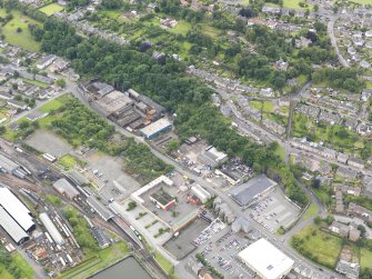 General oblique aerial view of New Grange Foundry and Railway Station, taken from the NE.