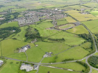 General oblique aerial view of Bannockburn, centred on Corbiewood Stadium, taken from the SW.