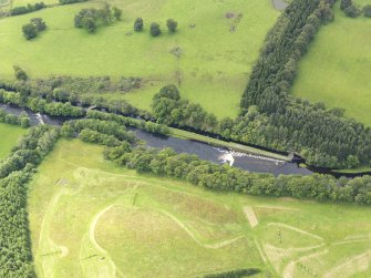 Oblique aerial view of Deanston Mills weir, taken from the NNE.