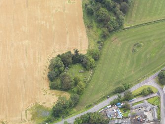 Oblique aerial view of St Lolan's Church, taken from the WSW.