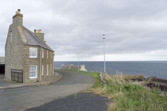 View of Boatman's House on the road leading down to harbour, taken from WNW