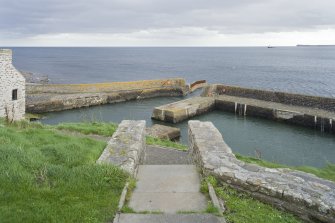 View looking down top of stair leading to Keiss harbour from Boatman's House, taken from NW