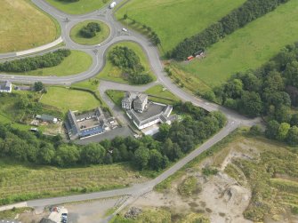 Oblique aerial view of Old Brig Inn, taken from the SW.