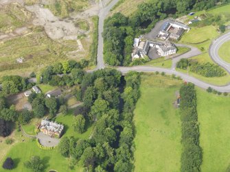 Oblique aerial view of Old Brig Inn and Beattock House Hotel, taken from the E.