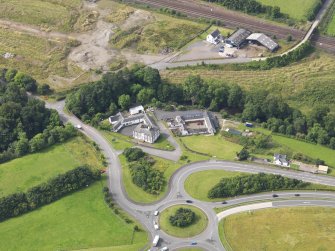 Oblique aerial view of Old Brig Inn, taken from the NE.