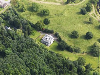 Oblique aerial view of Craigielands House and stables, taken from the SW.