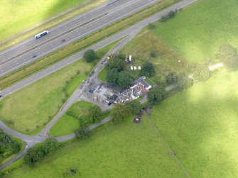 Oblique aerial view of Dinwoodie Lodge Hotel, taken from the ESE.