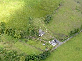 Oblique aerial view of Hutton and Corrie Parish Church, taken from the ENE.