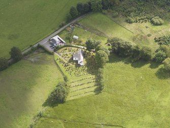 Oblique aerial view of Hutton and Corrie Parish Church, taken from the W.