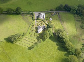 Oblique aerial view of Hutton and Corrie Parish Church, taken from the SW.