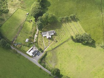 Oblique aerial view of Hutton and Corrie Parish Church, taken from the N.