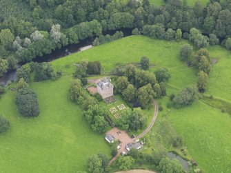 Oblique aerial view of Spedlin's Tower and garden, taken from the SW.