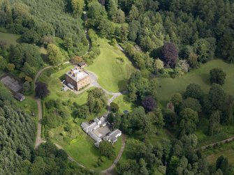 Oblique aerial view of Rammerscales House and policies, taken from the SSW.