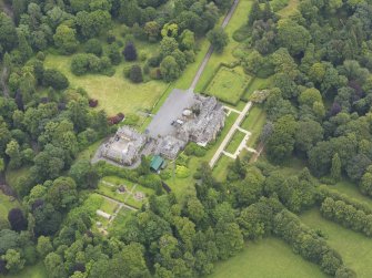 Oblique aerial view of Castlemilk country house, taken from the NW.