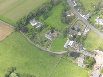 Oblique aerial view of Dornock Parish Church, taken from the SE.