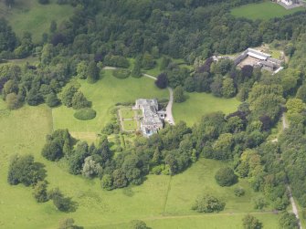 Oblique aerial view of Springkell House and stables, taken from the ESE.