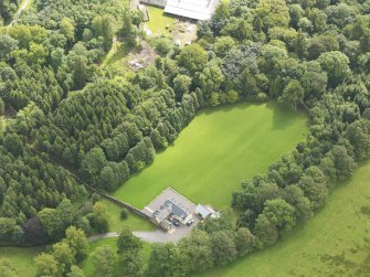 Oblique aerial view of Springkell House walled gardens, taken from the NW.