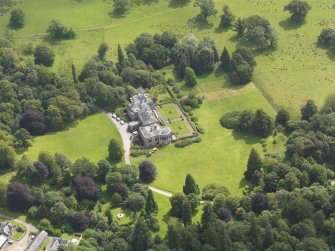 Oblique aerial view of Springkell House, taken from the NW.