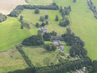 General oblique aerial view of Mossknowe House and policies, taken from the NW.