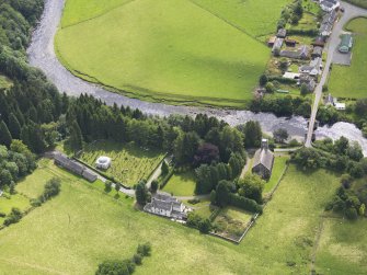 Oblique aerial view of Westerkirk Parish Church, taken from the NNW.