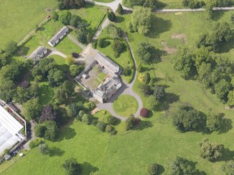 Oblique aerial view of Kirkconnel House and stables, taken from the SE.