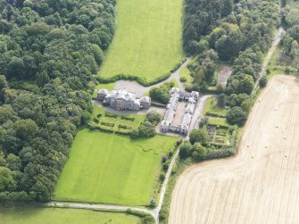 Oblique aerial view of Arbigland House and stables, taken from the NNE.