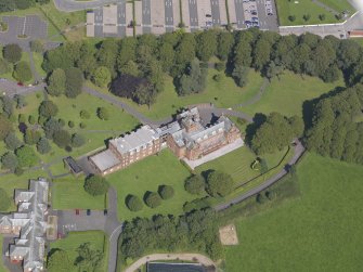 Oblique aerial view of Crichton Royal Hospital, centred on Rutherford House, taken from the SW.