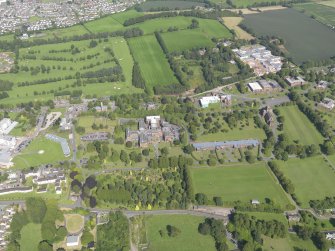 General oblique aerial view of Crichton Royal Hospital, taken from the WSW.
