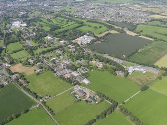 General oblique aerial view of Crichton Royal Hospital, taken from the SSW.