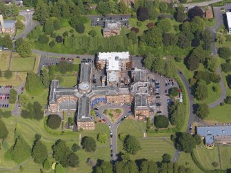 Oblique aerial view of Crichton Royal Hospital, centred on Crichton Hall, taken from the WSW.