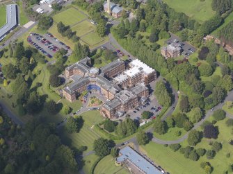 Oblique aerial view of Crichton Royal Hospital, centred on Crichton Hall, taken from the SSW.