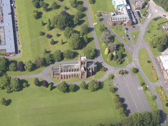 Oblique aerial view of Crichton Royal Hospital, centred on Crichton Memorial Church, taken from the SSE.