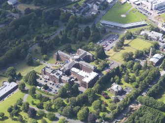 Oblique aerial view of Crichton Royal Hospital, centred on Crichton Hall, taken from the ESE.