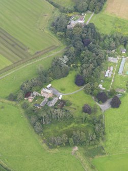 General oblique aerial view of Carnsalloch House and policies, taken from the SW.